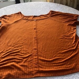 Ricki’s  burnt orange  button up top, short sleeves. Button top, new or like new